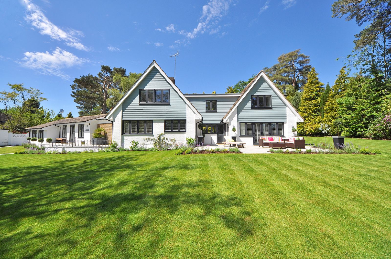 Contemporary two-storey house with manicured lawn, typical of East York and Etobicoke investor houses