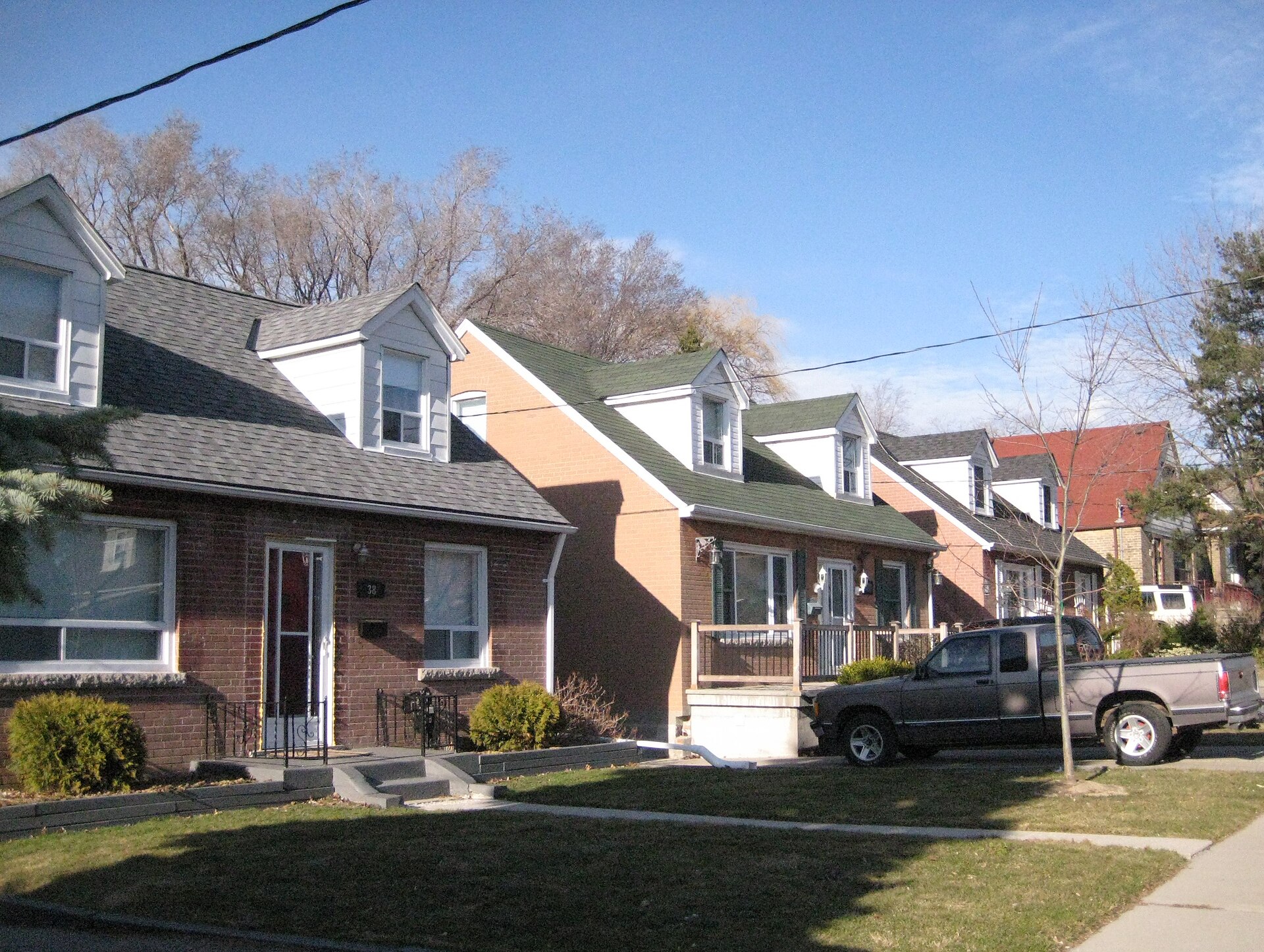 Detached and semi detached brick houses with front lawns and driveways in O'Connor Parkview, East York, Toronto Detached and semi detached brick houses with front lawns and driveways in O'Connor Parkview, East York, Toronto