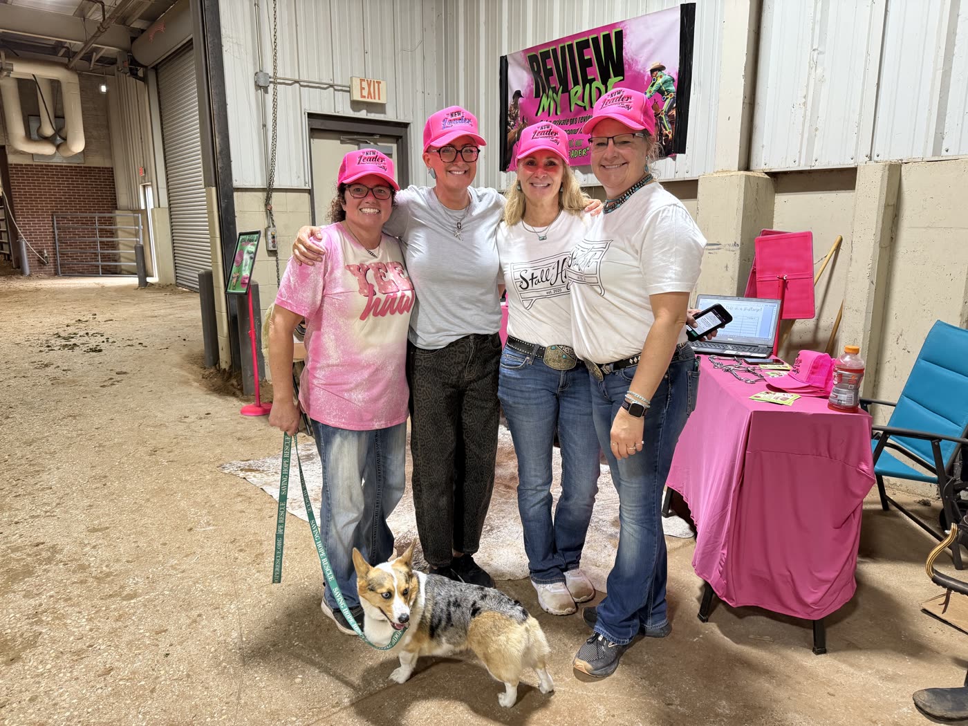 Stall High team in pink caps at the Stall High booth