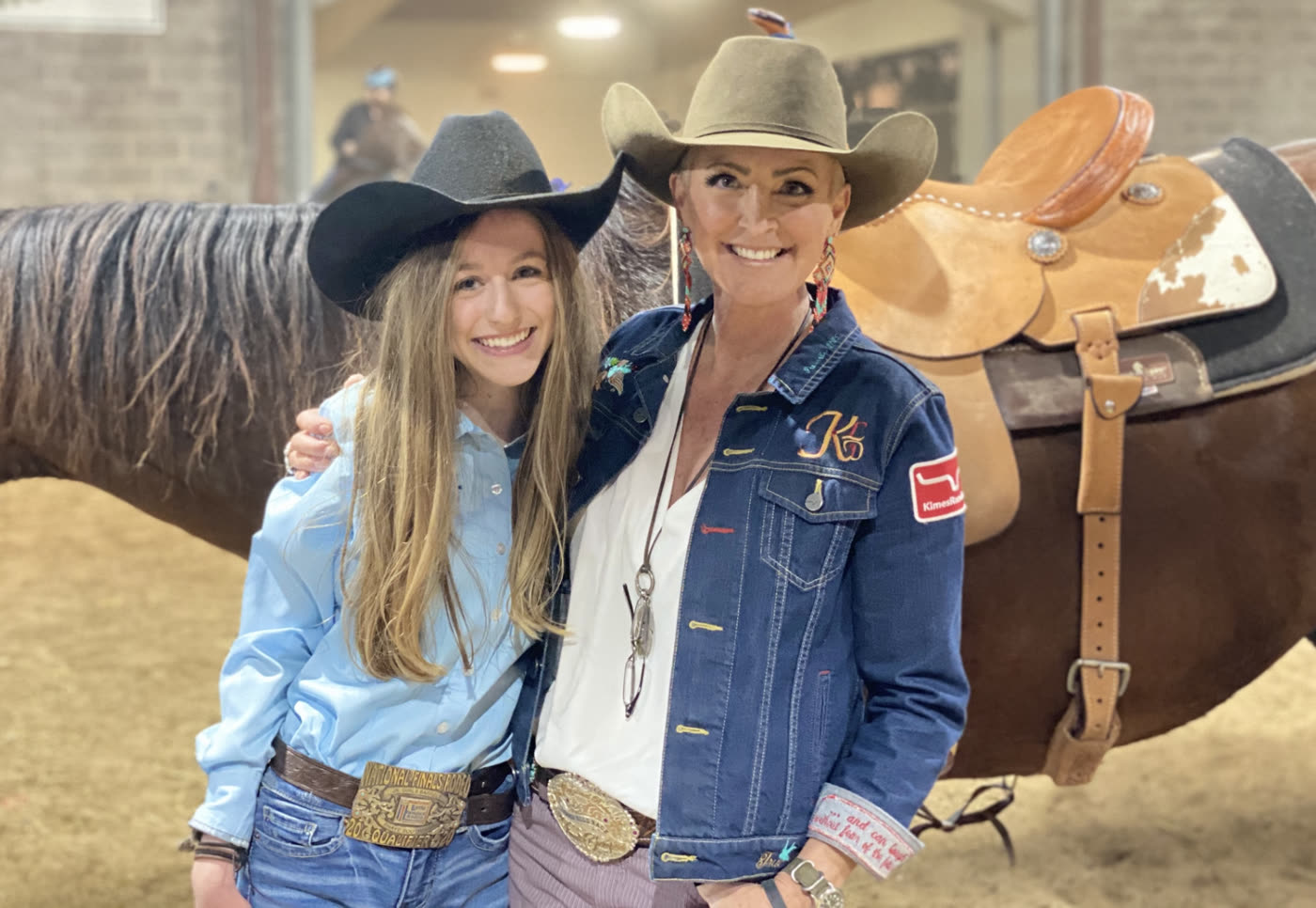 Kendra Dickson (KD) with a young rider in the arena