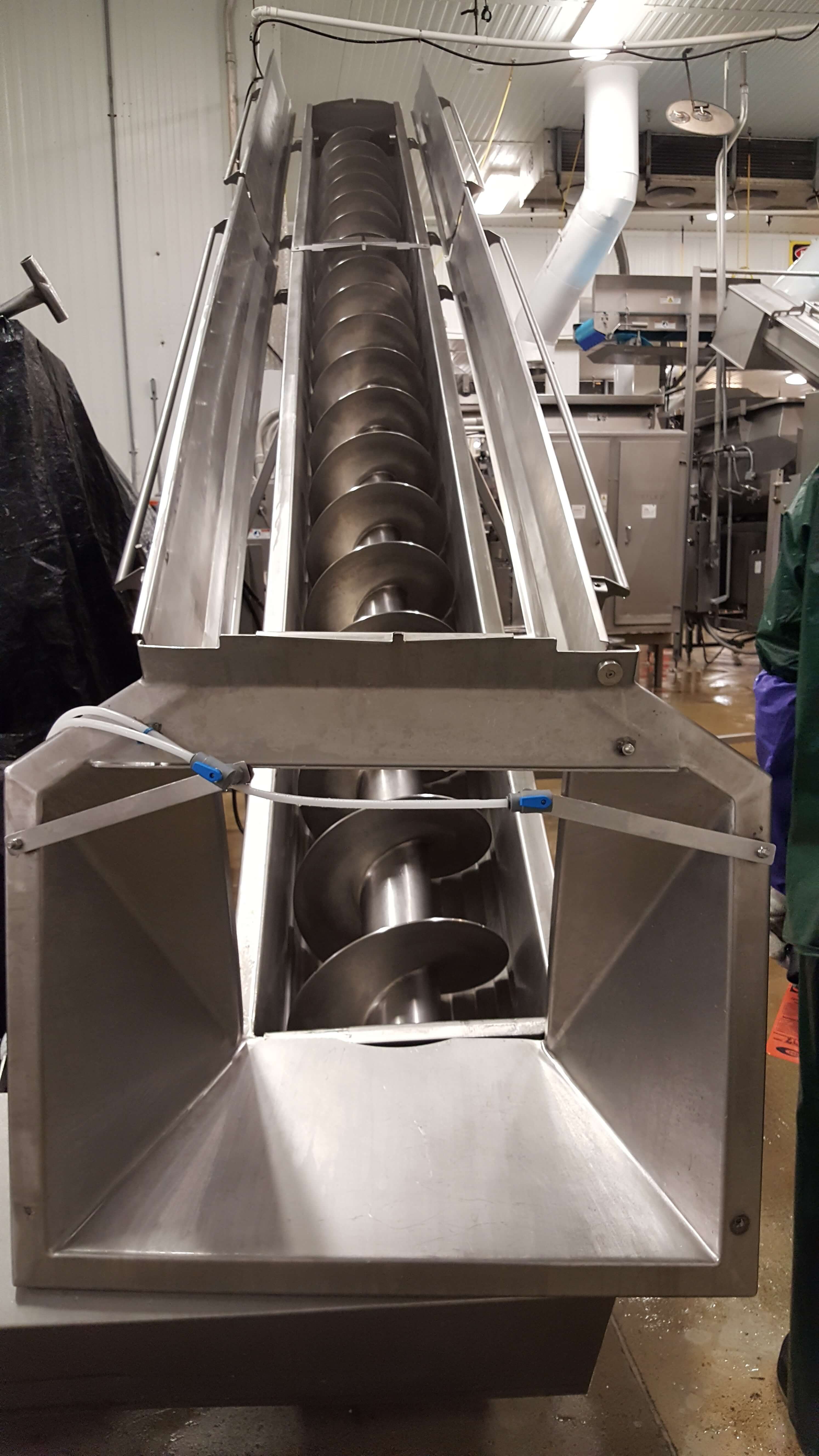 Auger equipment in a food processing facility