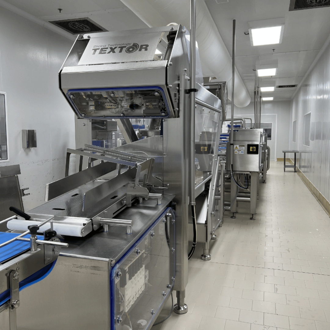 Slicing line equipment in a food processing facility
