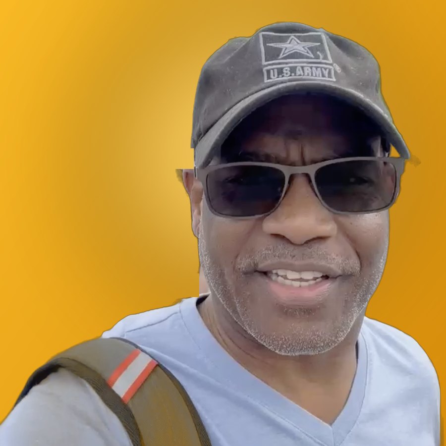 Dwayne Golden smiling in a U.S. Army cap