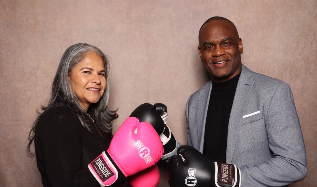Dwayne Golden and his wife wearing boxing gloves
