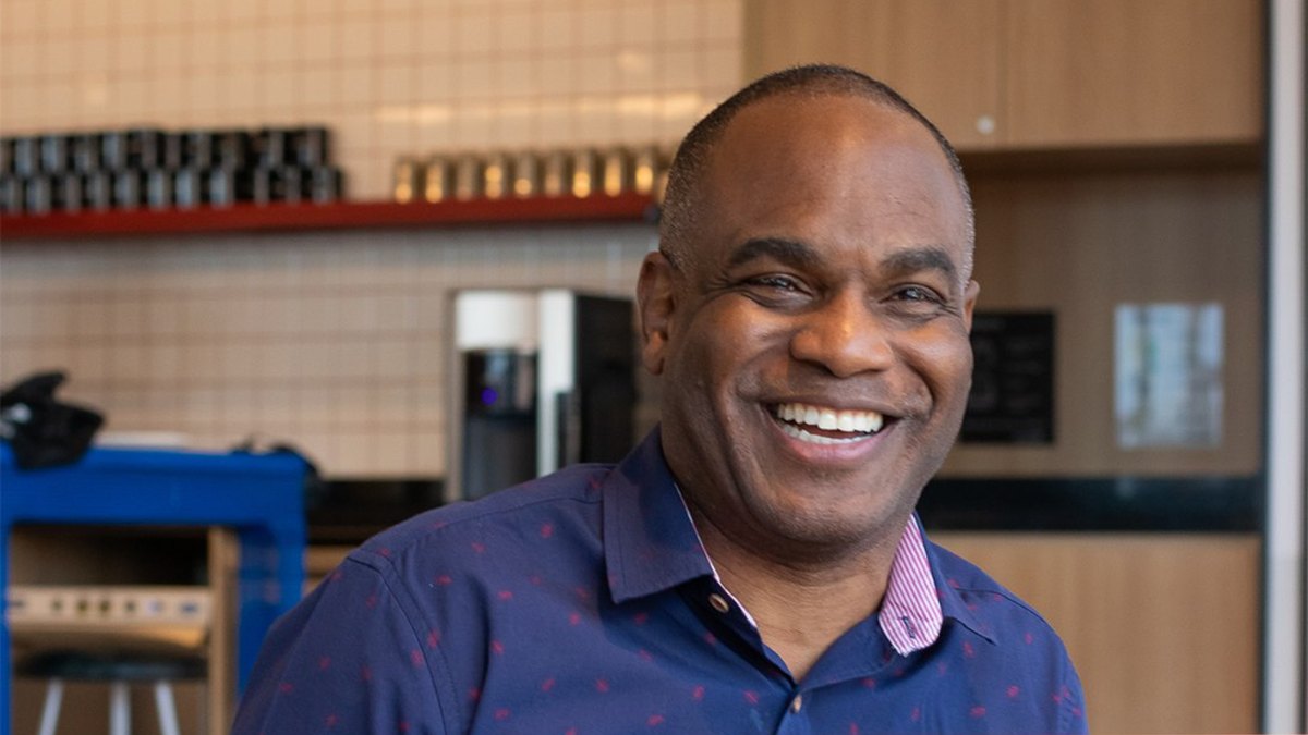 Dwayne Golden smiling at his laptop