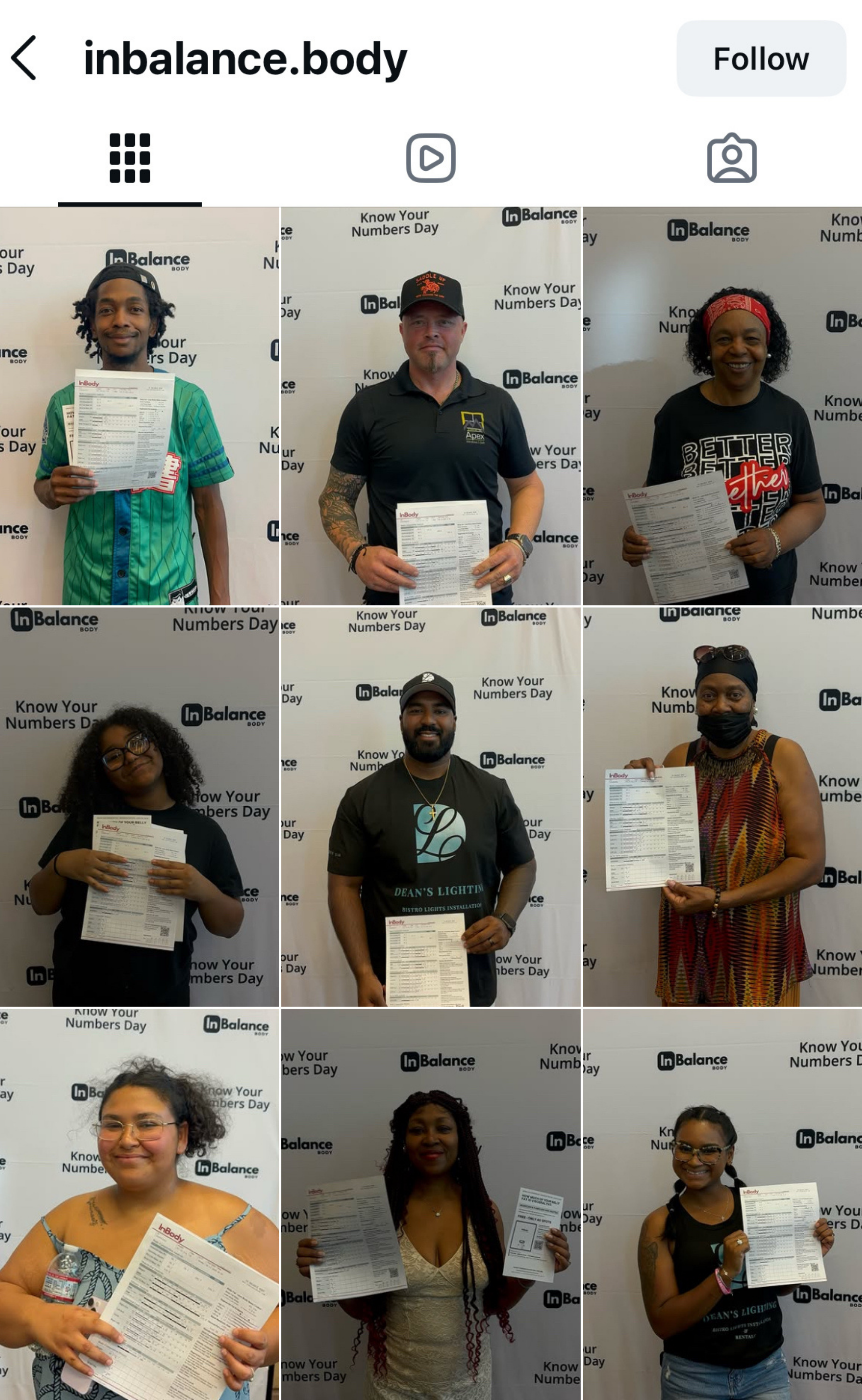 Participants at a Know Your Numbers Day, each holding their printed result sheet
