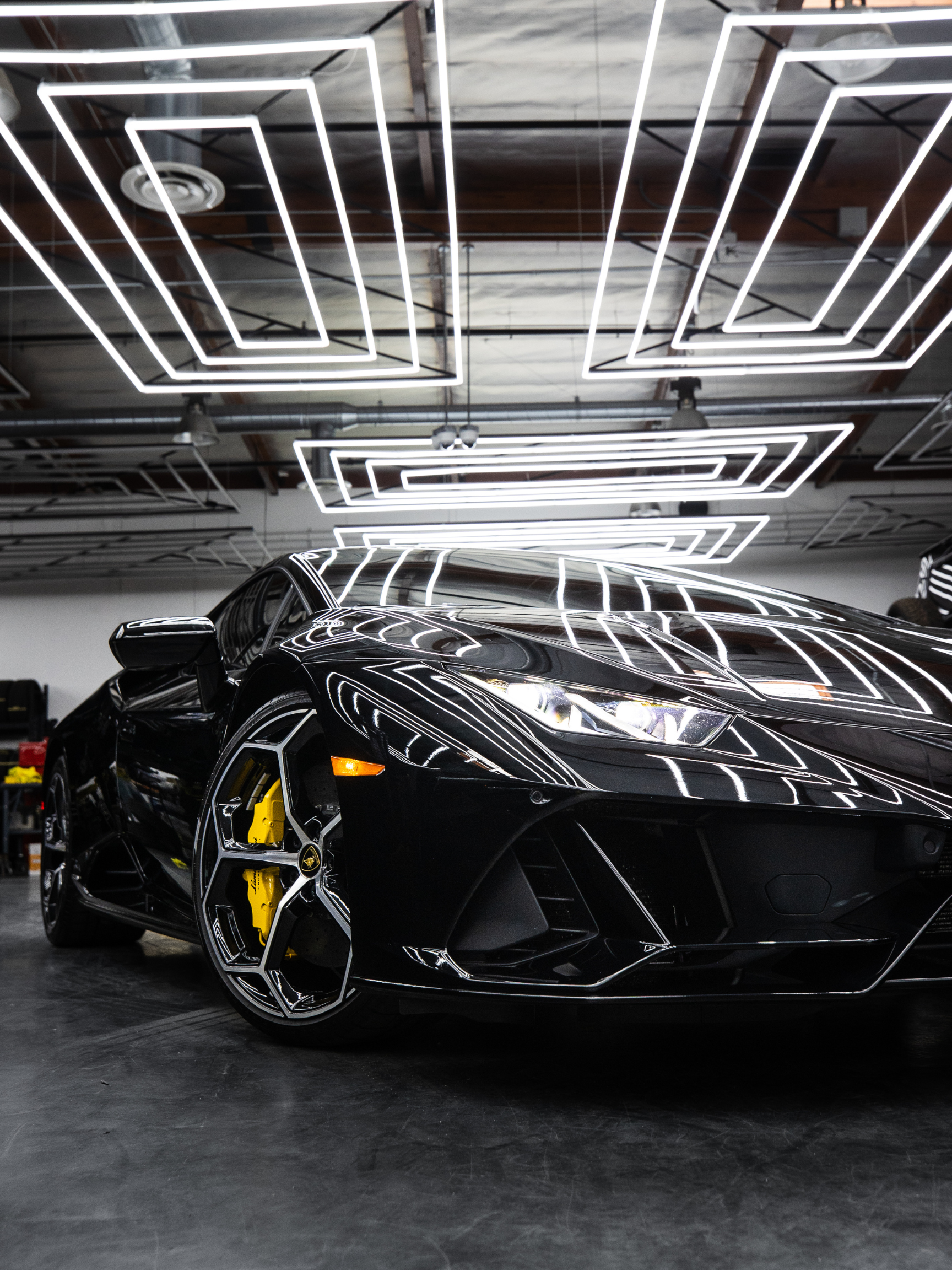 Luxury vehicles in a dark garage