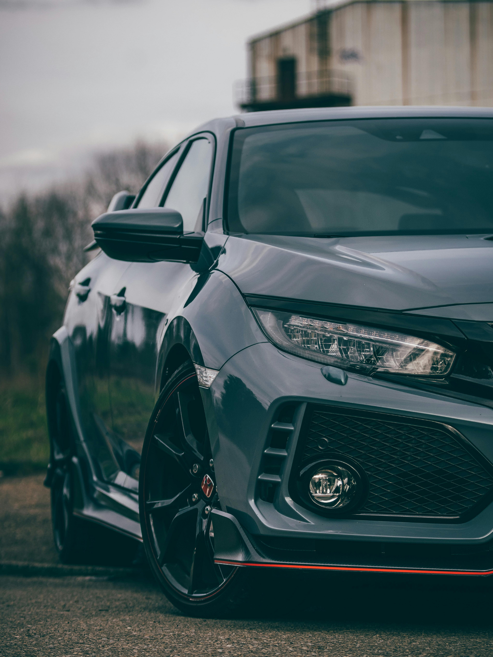 Dark sedan parked in a garage