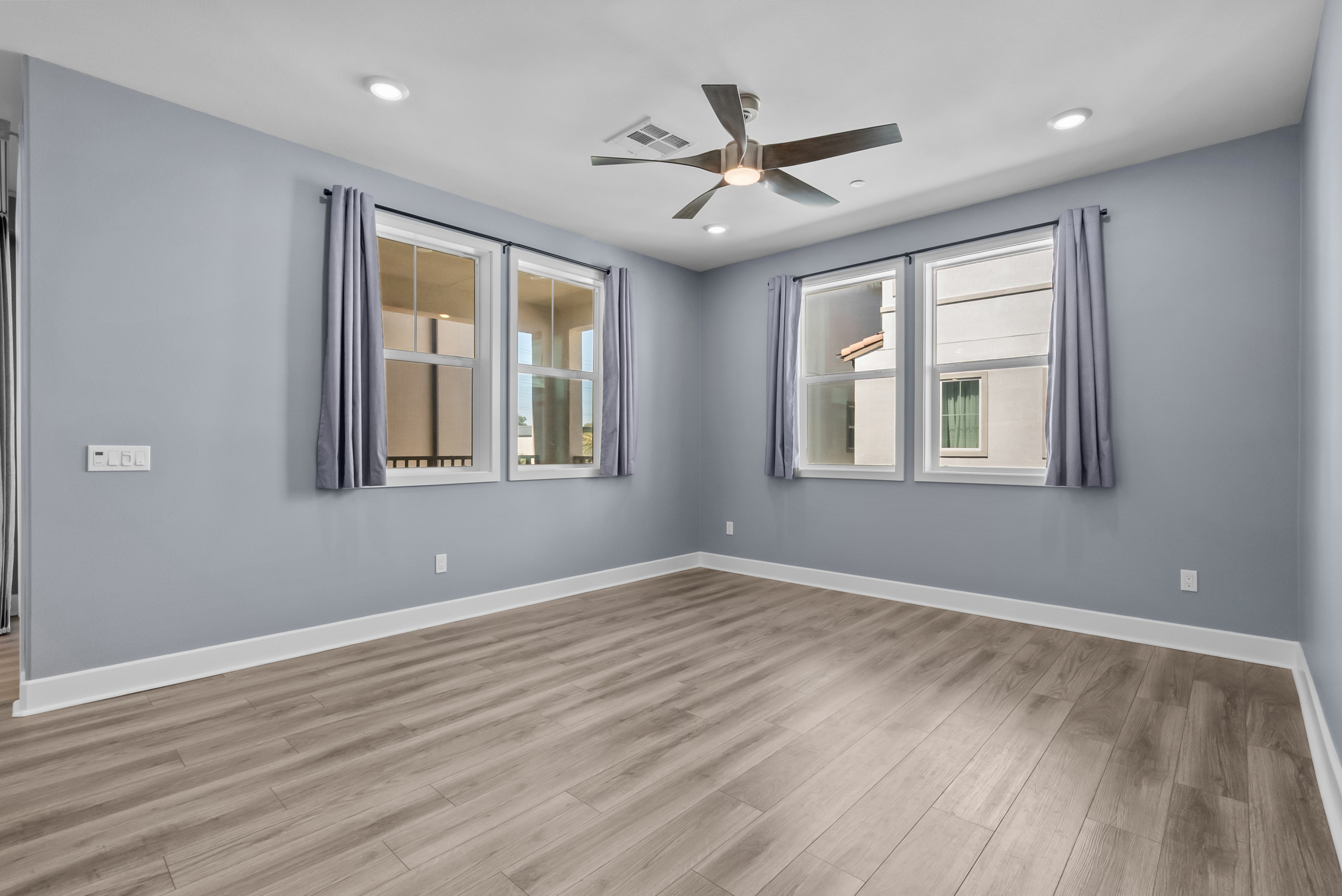 Bright living space with two walls of windows