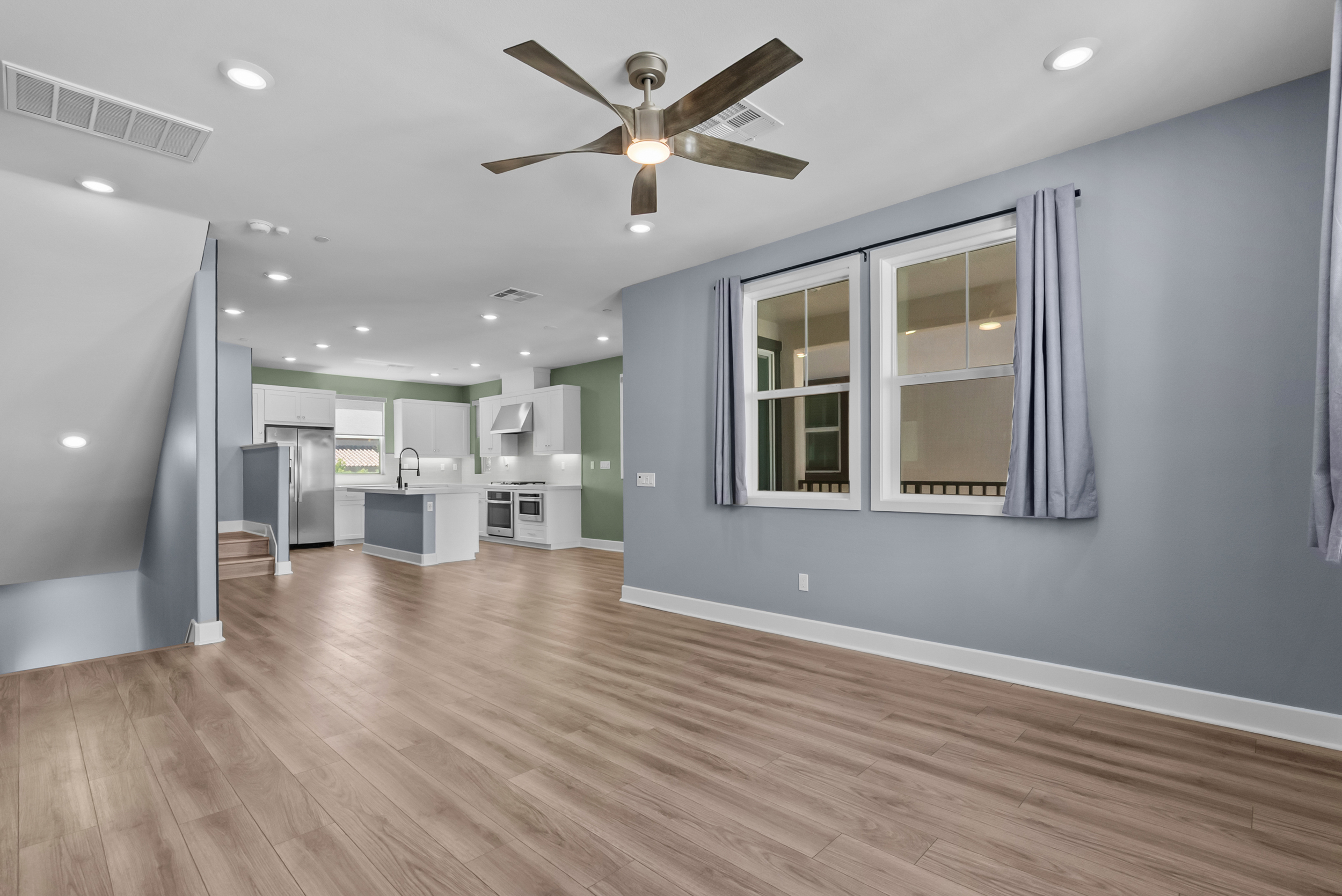 Open living room flowing into the kitchen