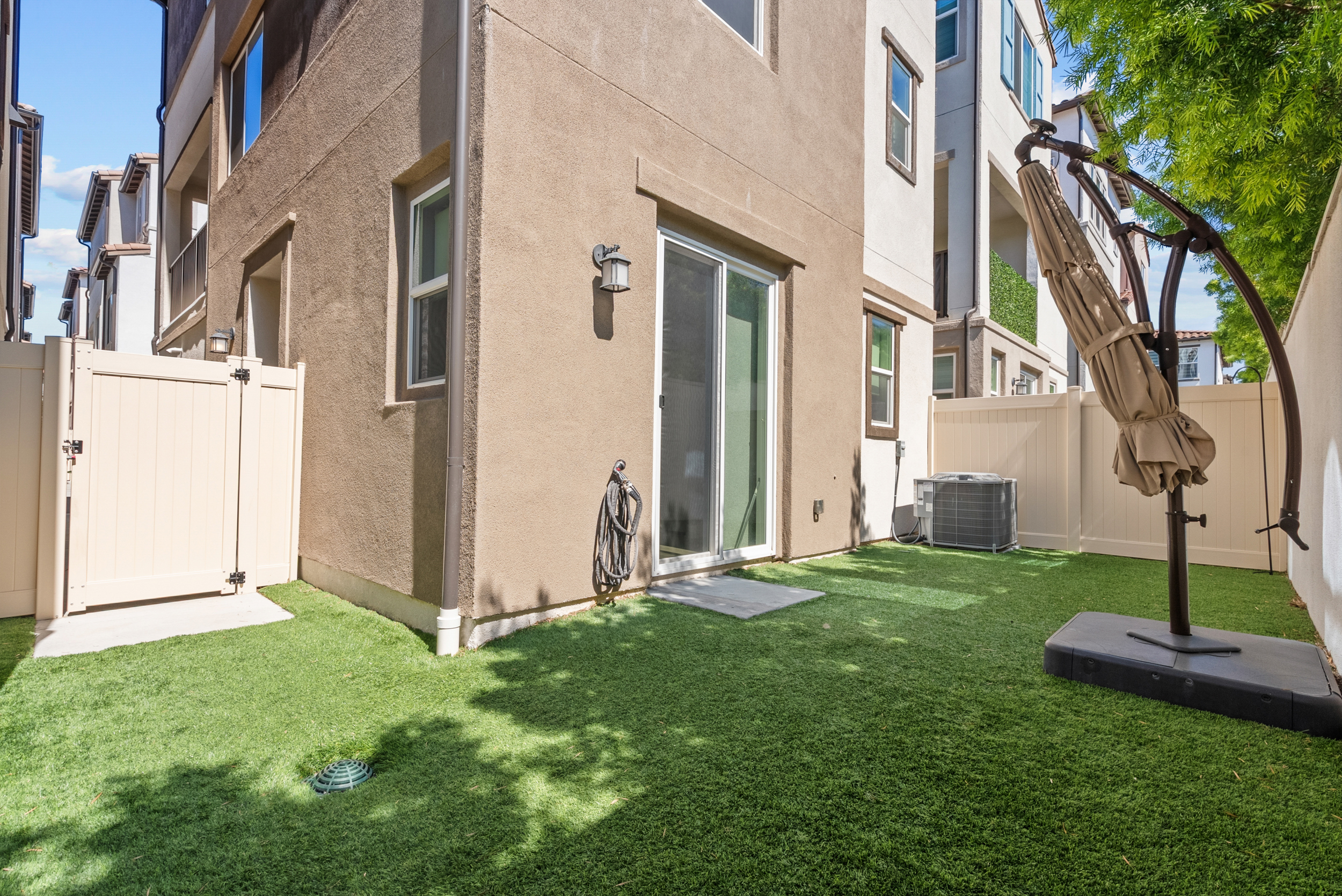 Private backyard with low-care turf