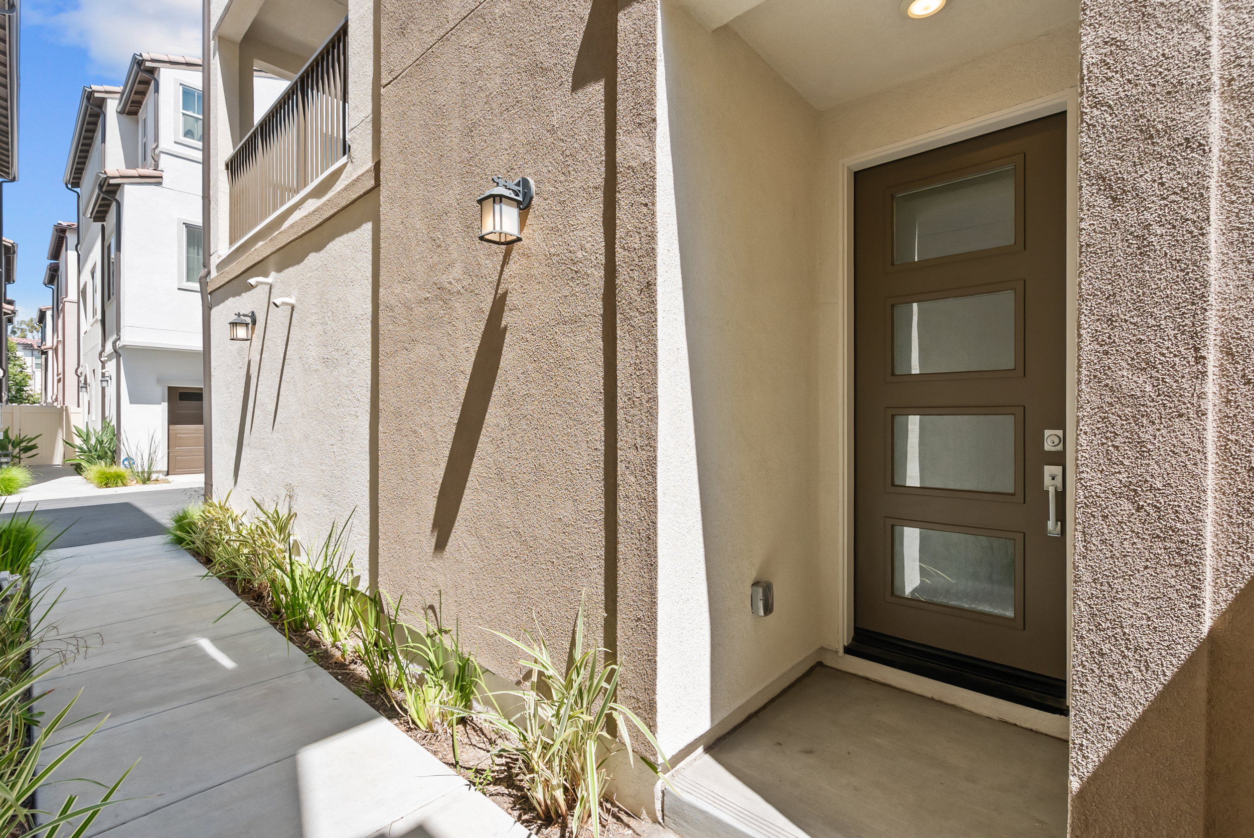 Modern front entry with glass-panel door