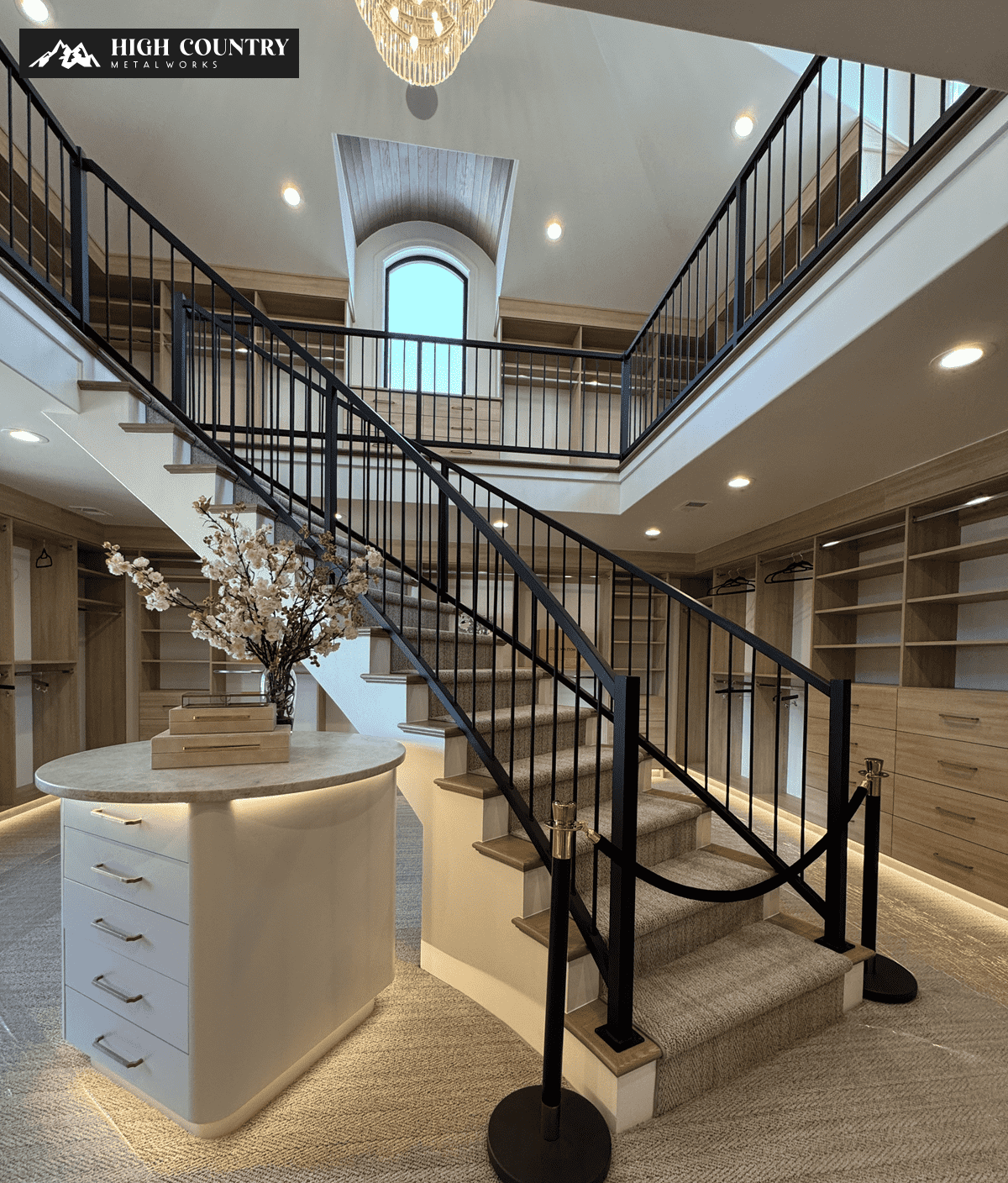 A walkway featuring a staircase with custom and pre-fabricated railings by high country metal works. A walkway featuring a staircase with custom and pre-fabricated railings by high country metal works.