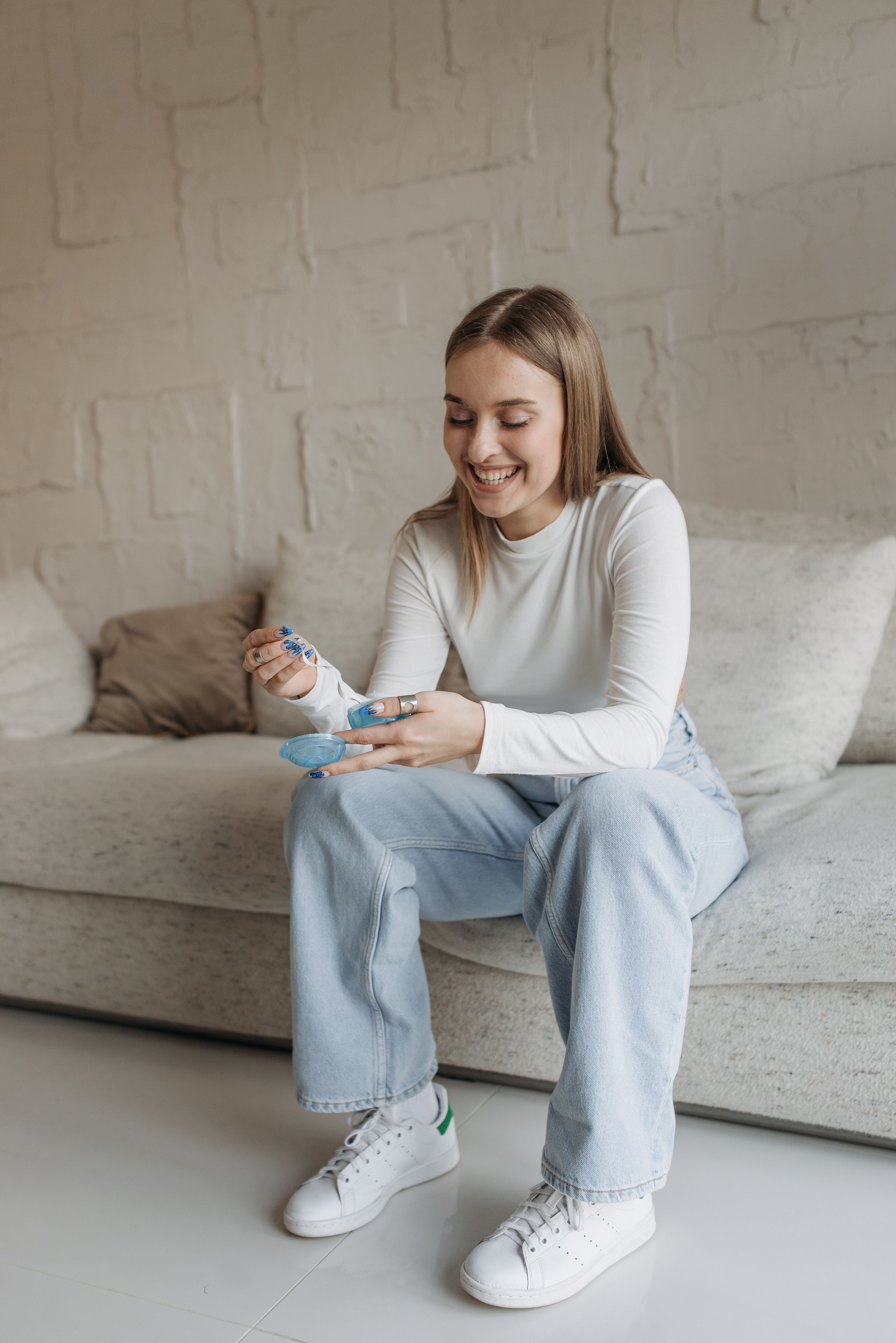 Adult smiling confidently during Invisalign treatment