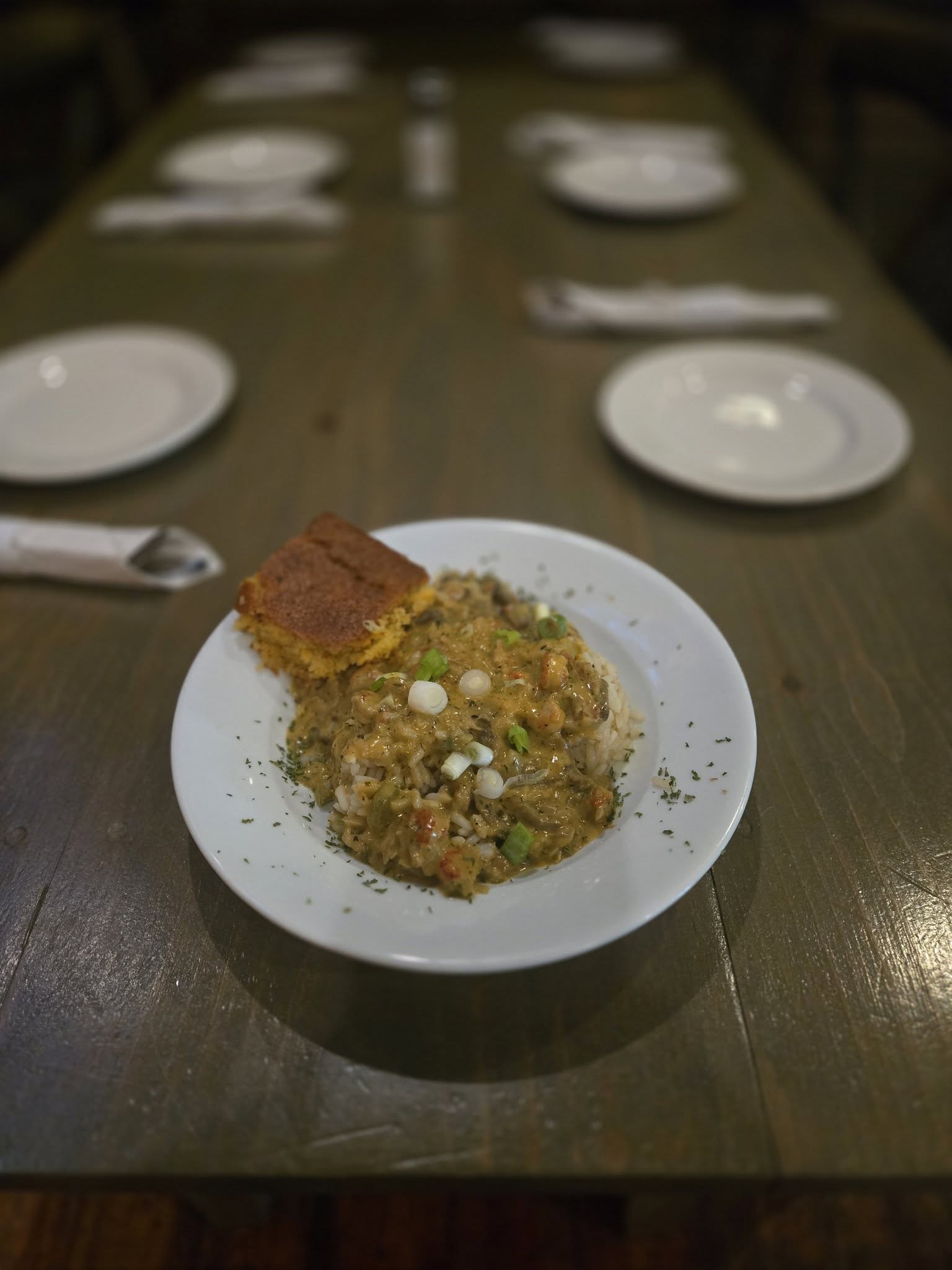 Crawfish étouffée over rice with cornbread