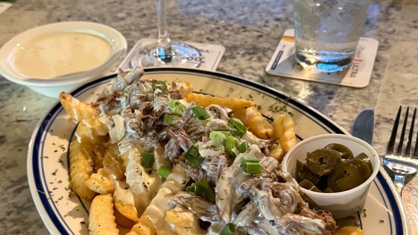 Haystack fries loaded with roast beef debris and queso