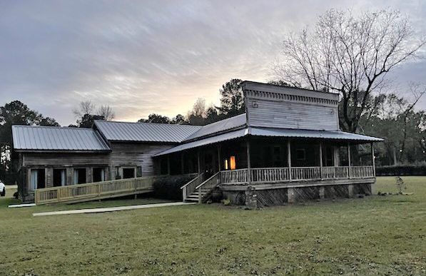 The old timber hall on Highway 589 at dusk