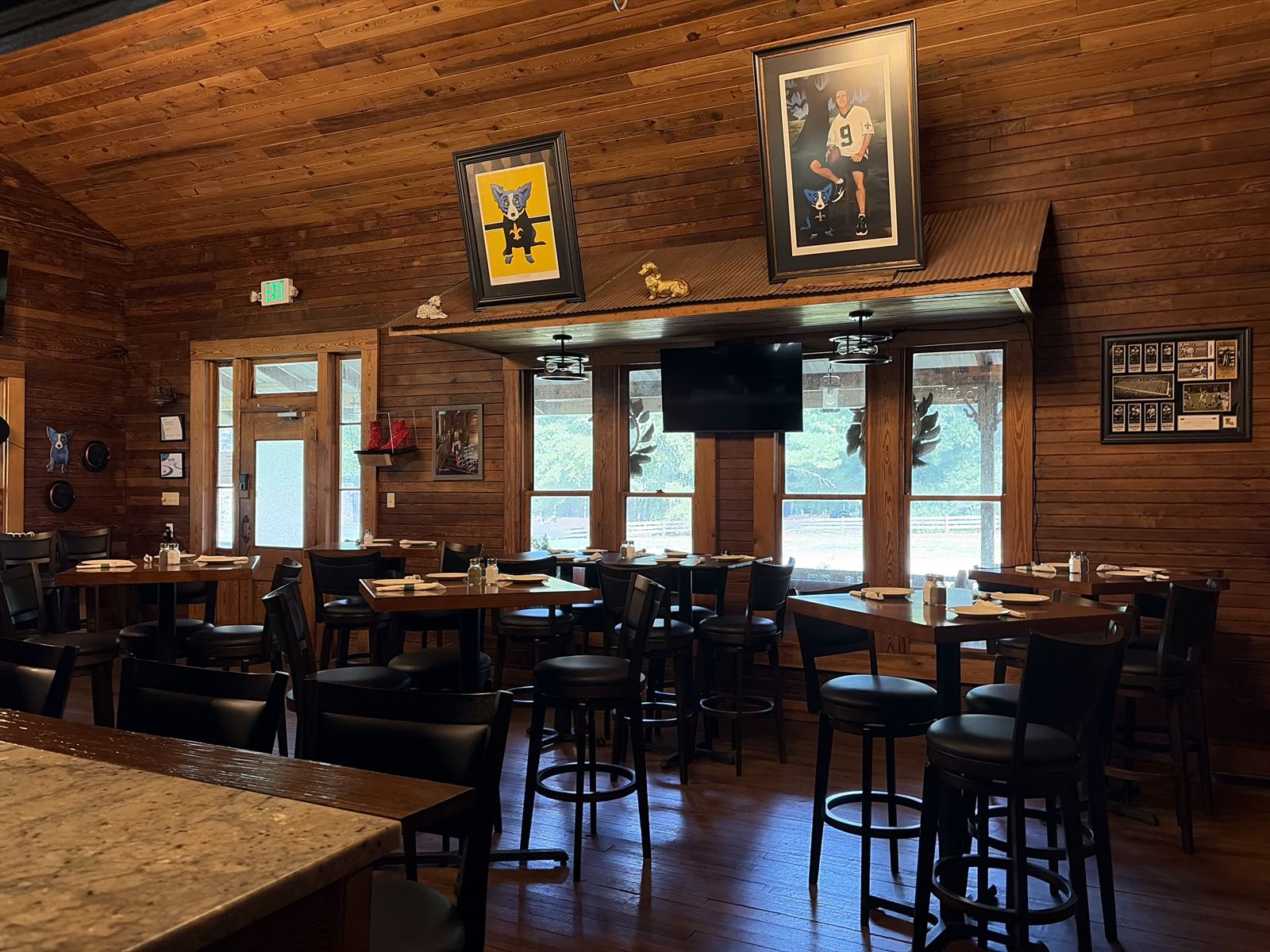 High-top tables and game-day TVs in the Pub at Haifa's
