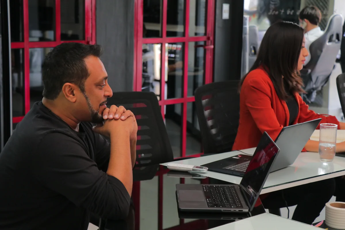 Lateef Farooqui, founder of Boss Up Solutions, working at a laptop