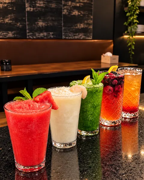 Row of colourful mocktails on the bar