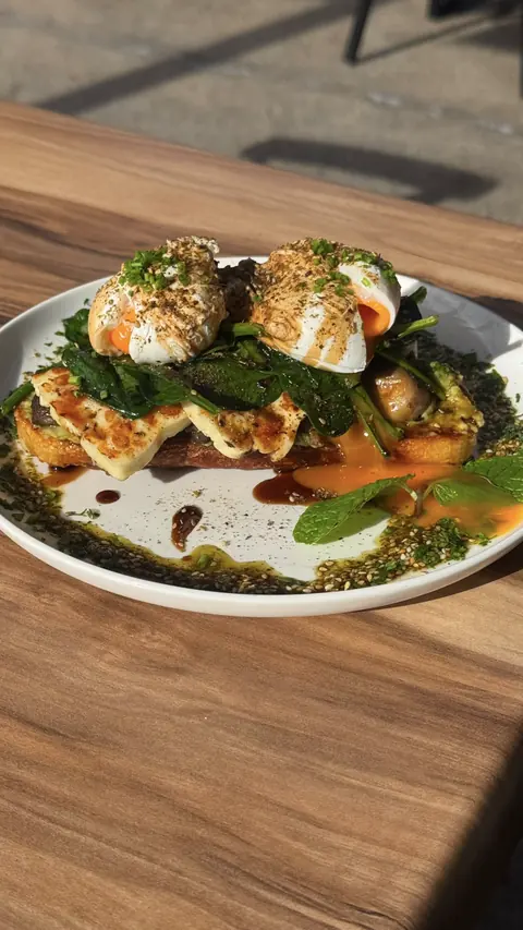 Halloumi sourdough stack with poached eggs and spinach