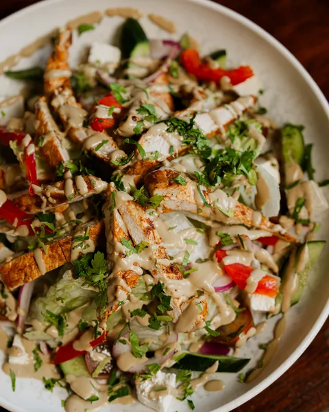 Chicken salad with grilled chicken, feta, cucumber and tomato