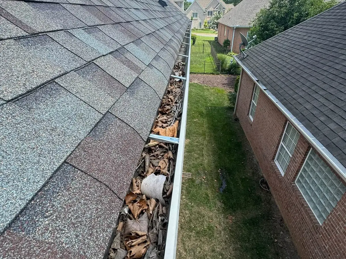 Before: gutter packed with leaves and debris in Hendersonville, TN