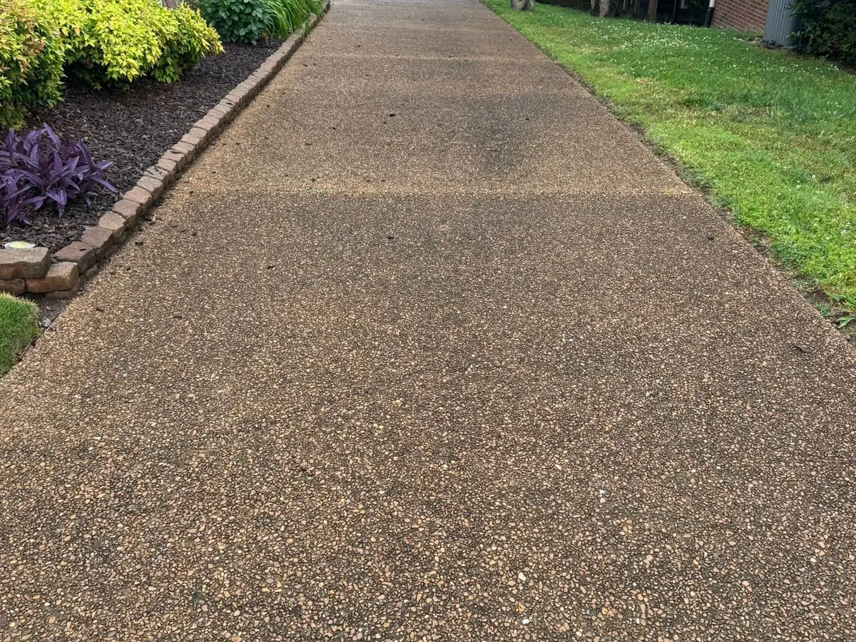 Before: aggregate driveway before Wash Wizard cleaning
