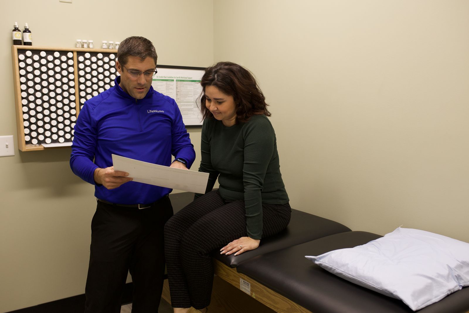 Dr. Matt going over a report with a visitor