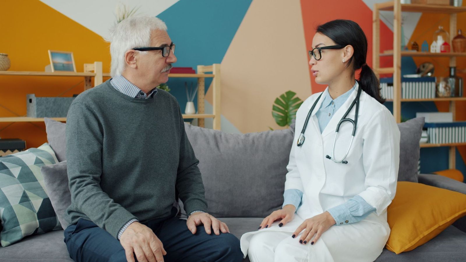 A clinician talking with an older man