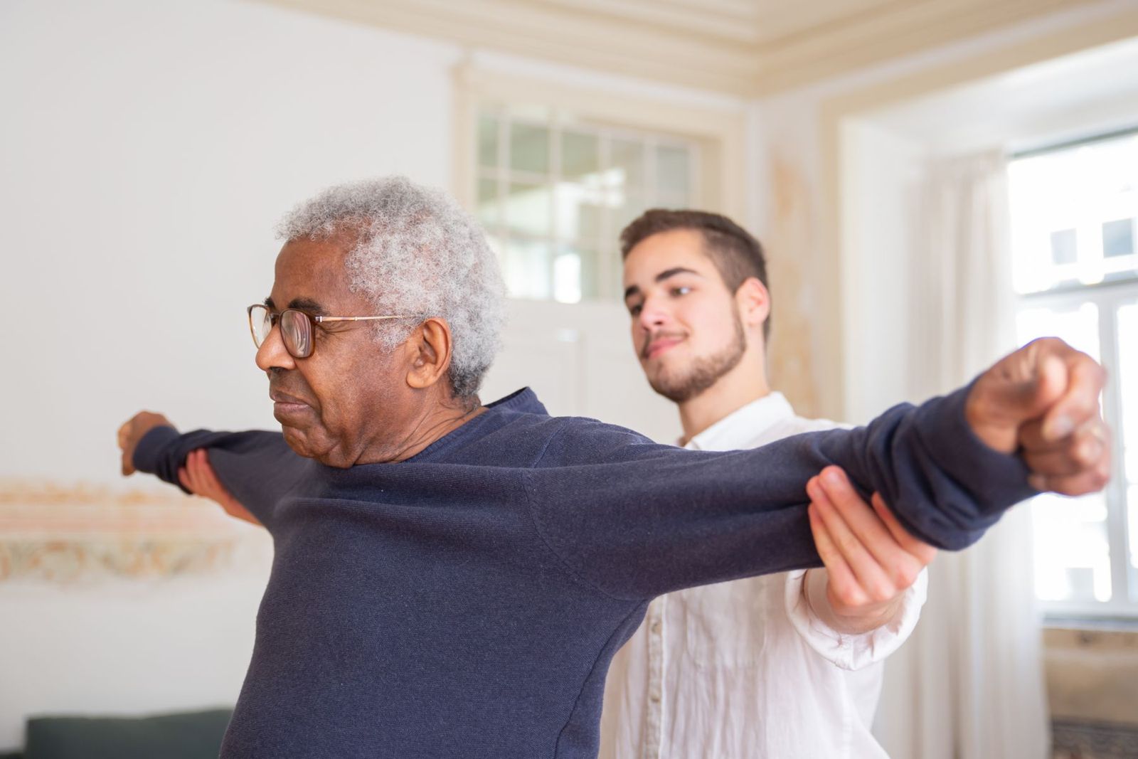 An older man doing guided exercises