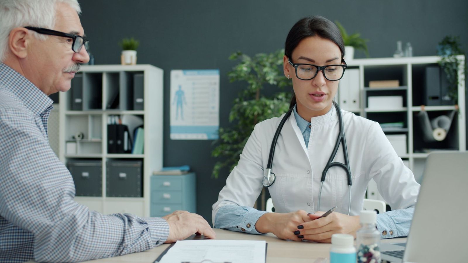 A clinician going over results with an older man