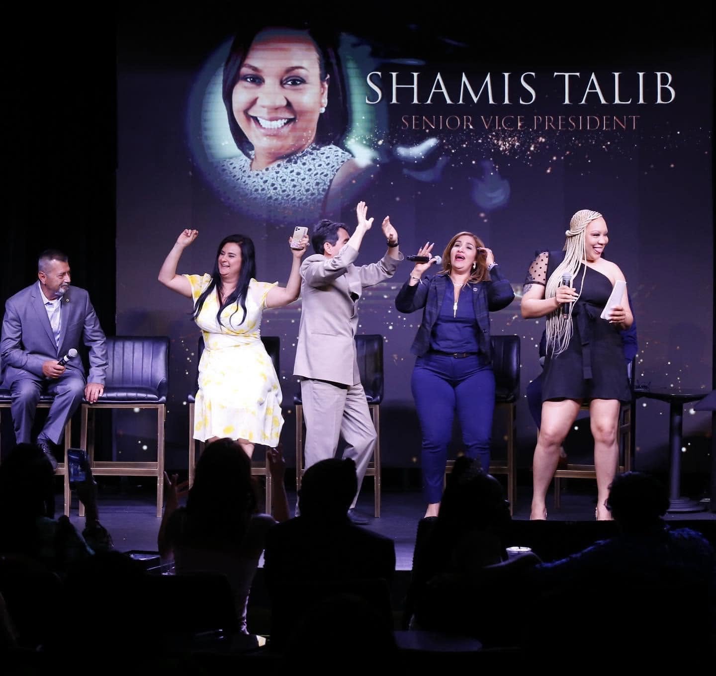 Shamis Talib, Senior Vice President, on stage