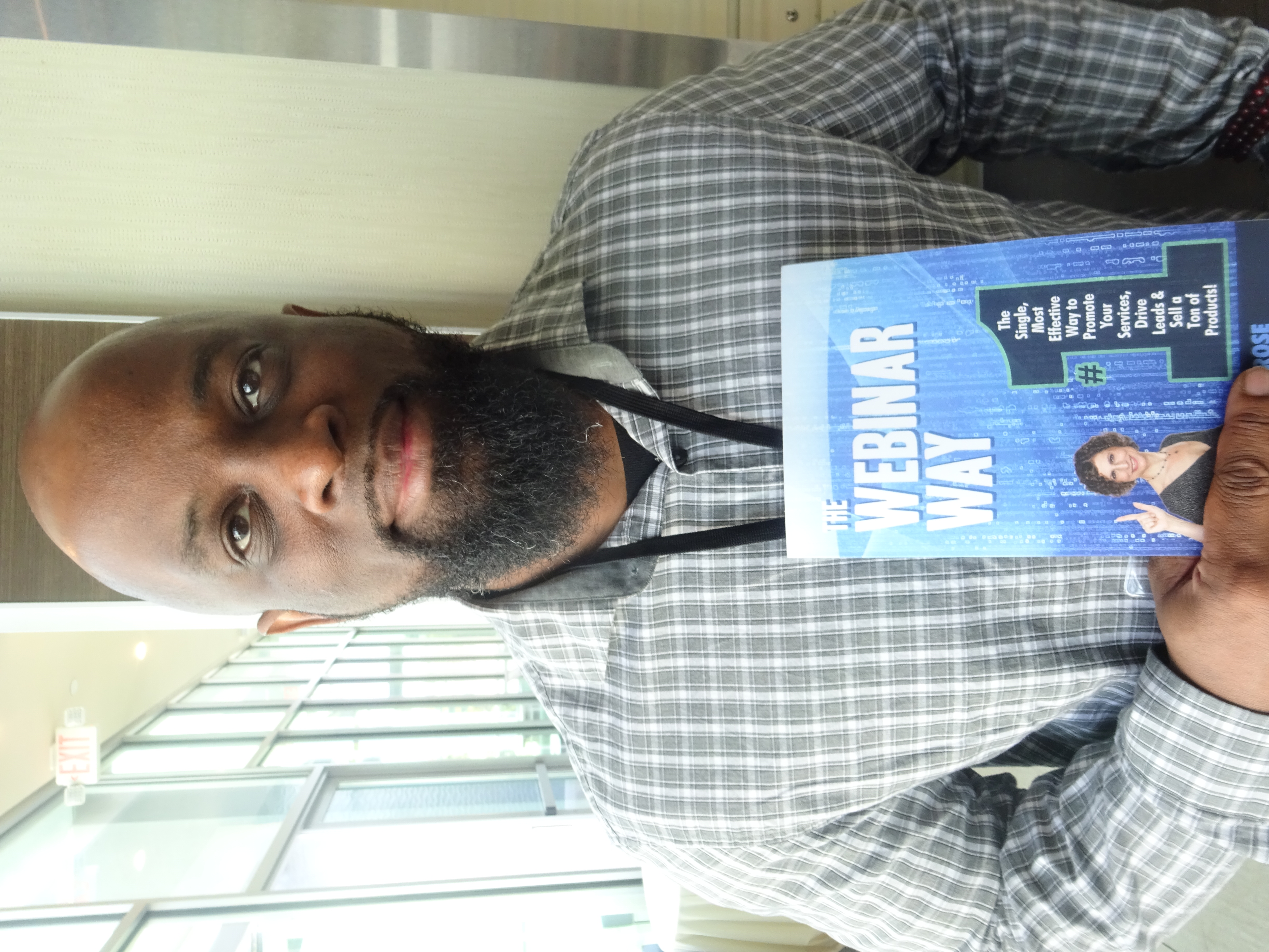 Photo of book, The Webinar Way by Sherrie Rose, author, in a portrait