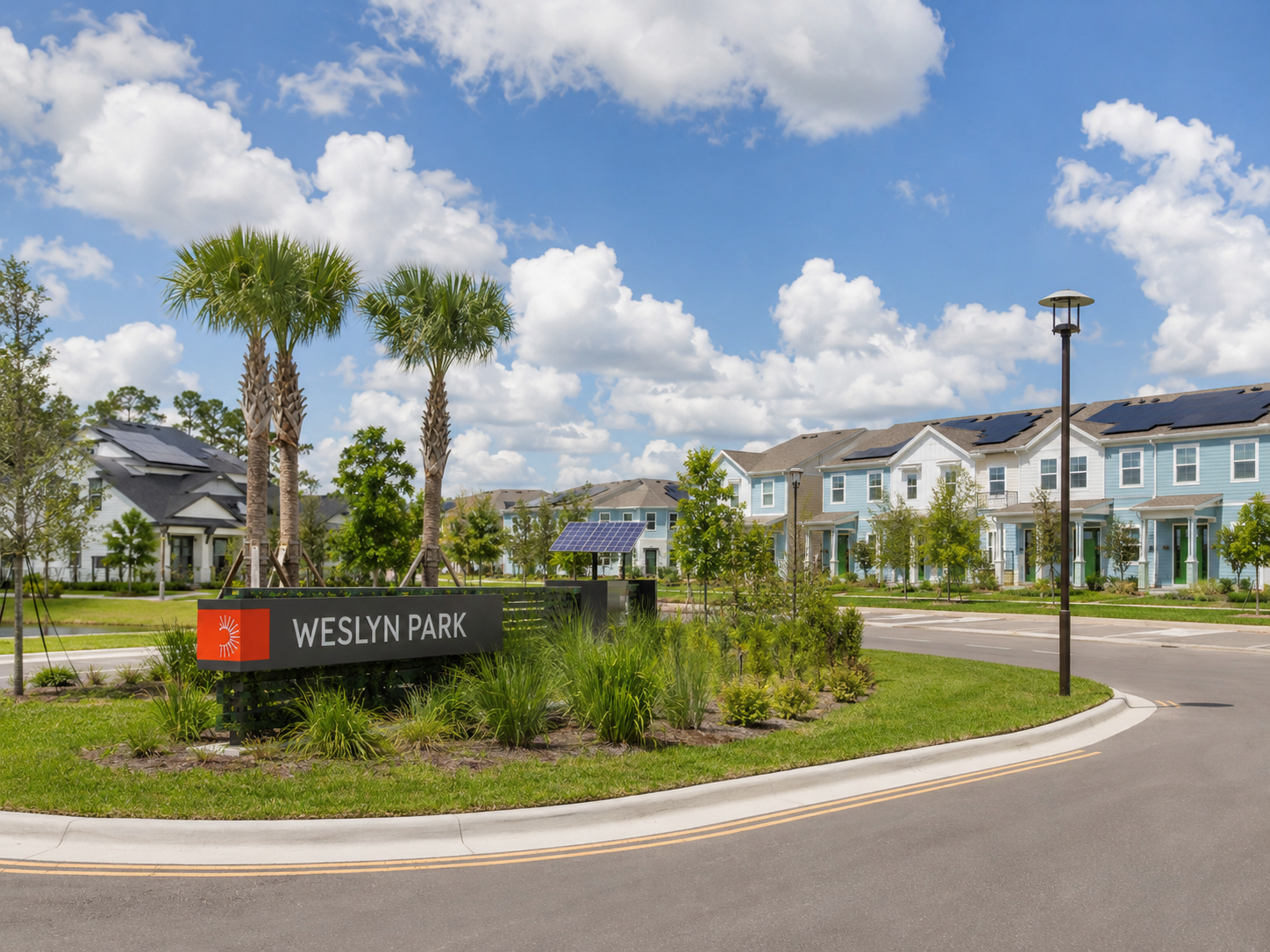 Weslyn Park at Sunbridge community entrance in St. Cloud, Florida, with modern homes, solar panels, palm trees, and landscaped streets.