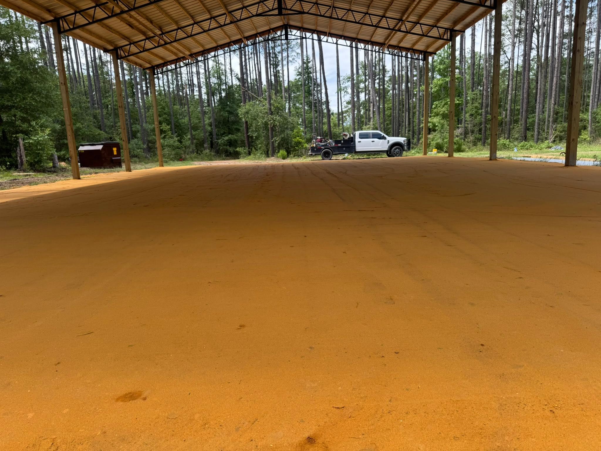 Interior view of a completed pole barn structure after site grading in Guyton, GA