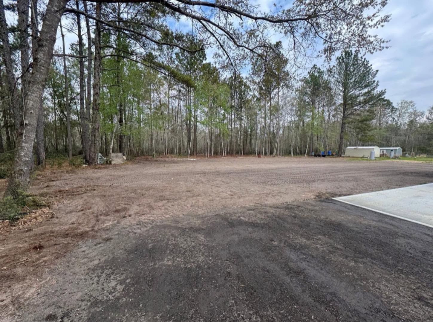 Land clearing crew grading a cleared lot in Guyton, GA