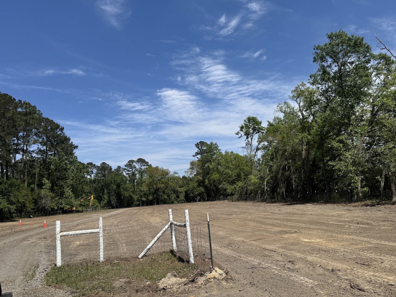Fenced and staked property line marked for land clearing in Guyton, GA