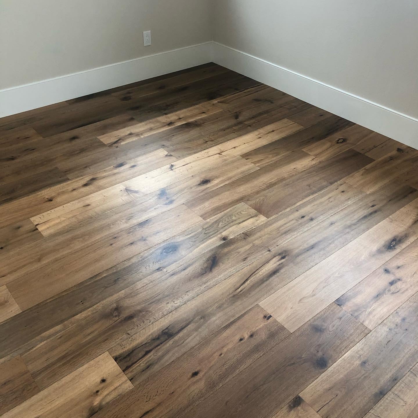 Rustic wood-look luxury vinyl plank flooring installed in a mobile home bedroom in Statesboro, GA