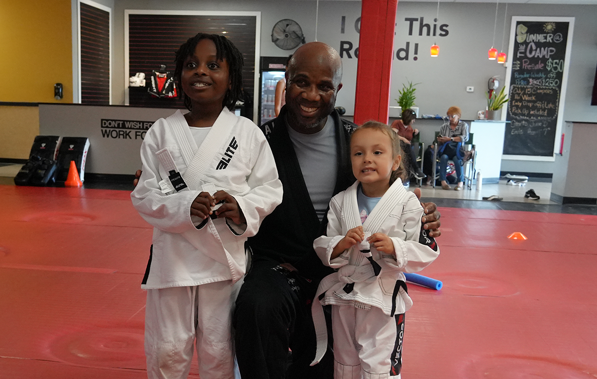 Kids practicing Brazilian Jiu Jitsu techniques, highlighting physical health benefits including fitness and coordination