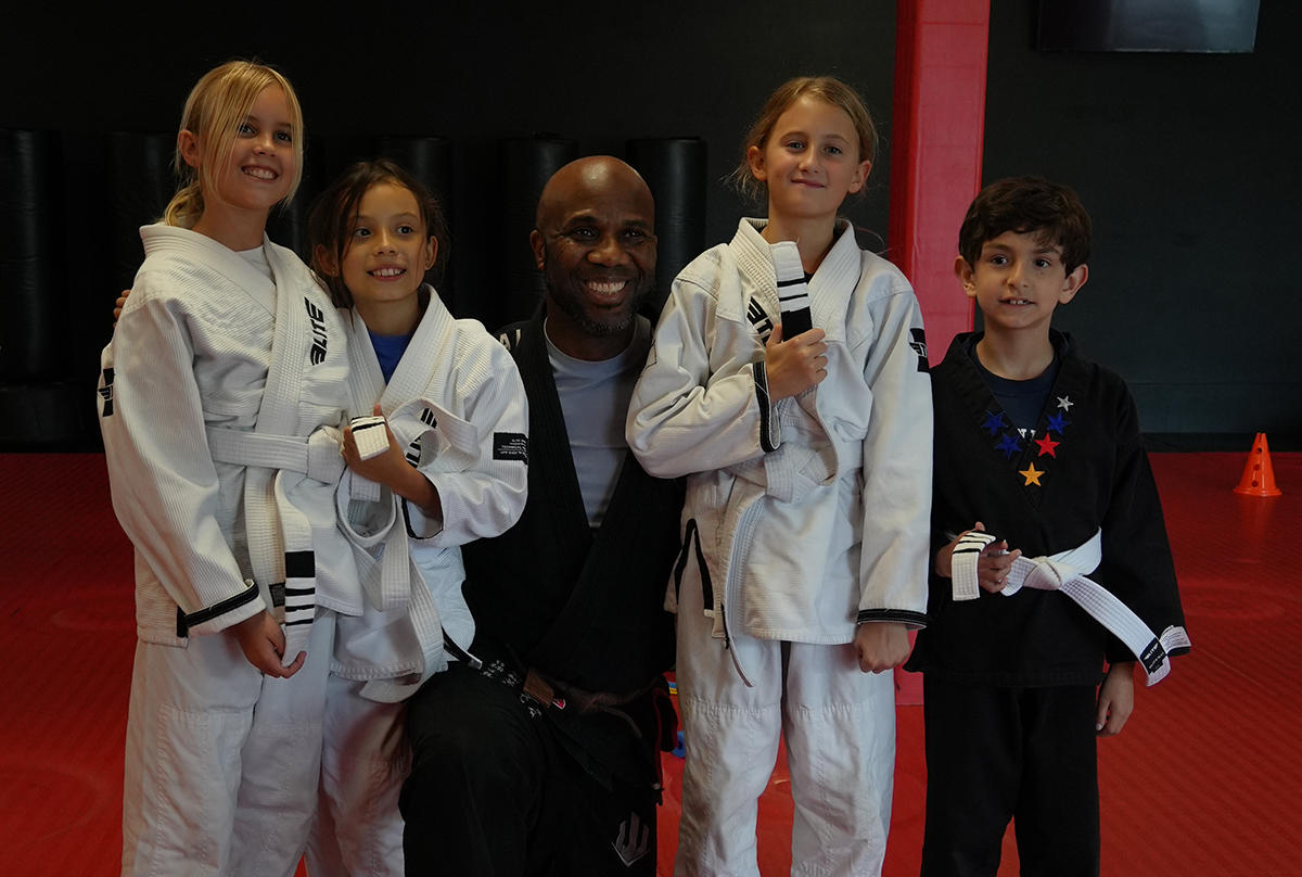Children training in Muay Thai and Brazilian Jiu Jitsu, showcasing the physical and social benefits of martial arts