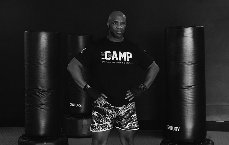 Head instructor Coach Osei Xavier standing ready on the mats at The Camp Martial Arts Training Center in Pompano Beach Head instructor Coach Osei Xavier standing ready on the mats at The Camp Martial Arts Training Center in Pompano Beach