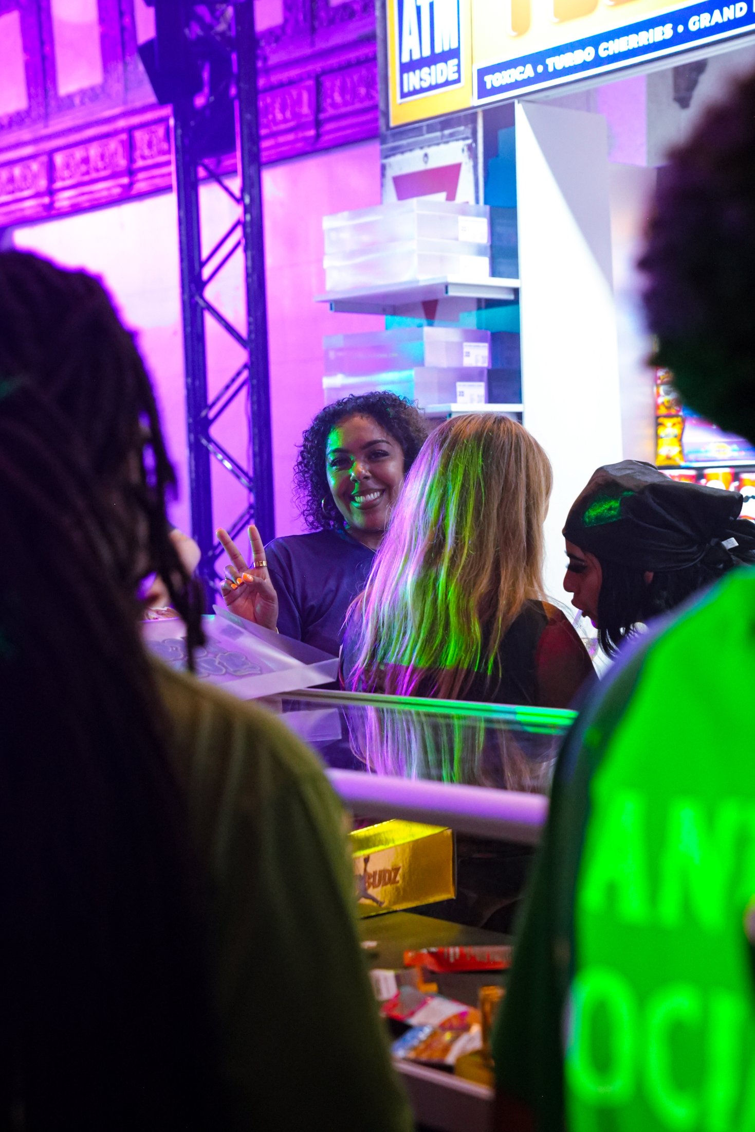 Brand ambassador greeting guests at a custom retail counter