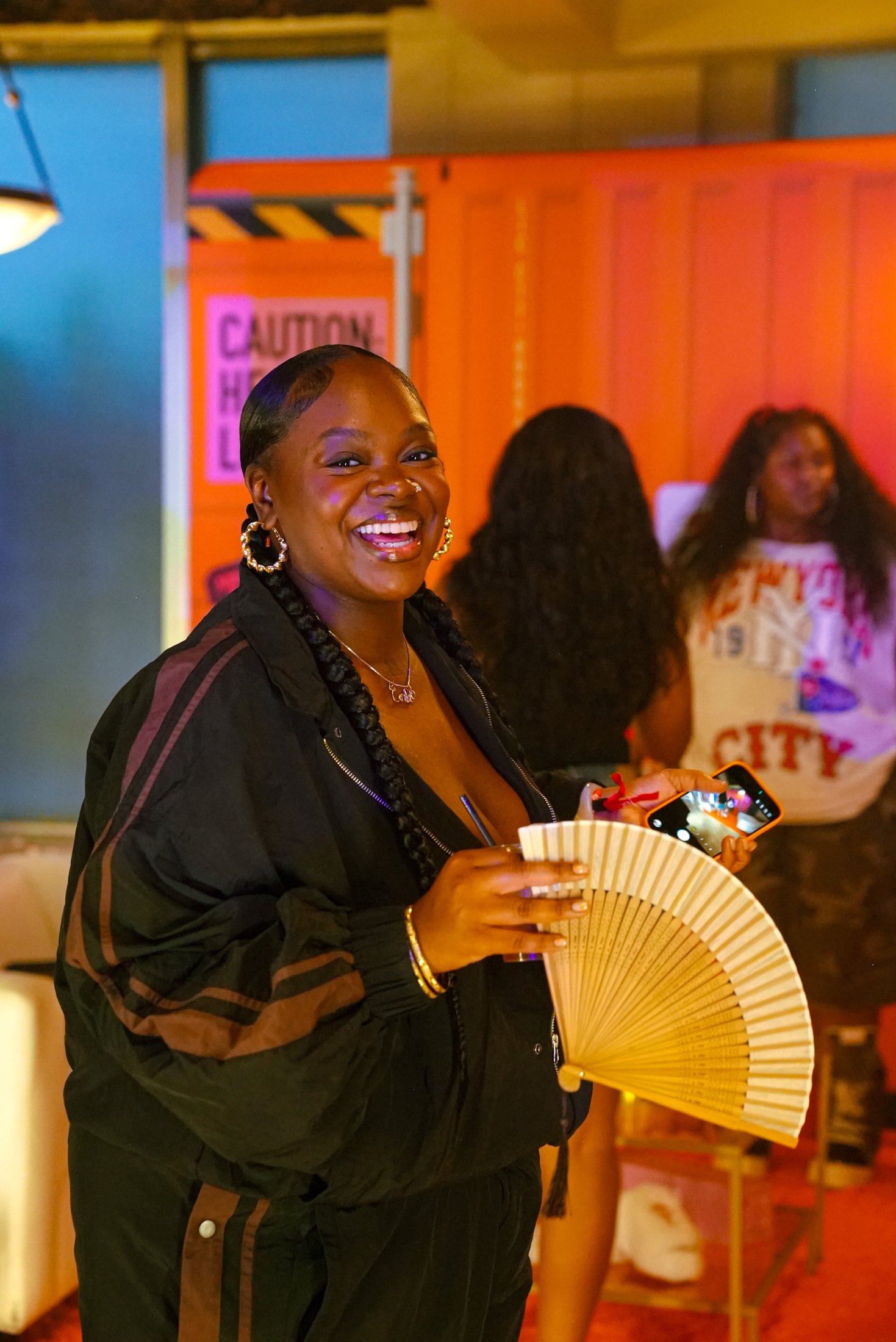 Guest in the branded celebrity merch lounge built by MES