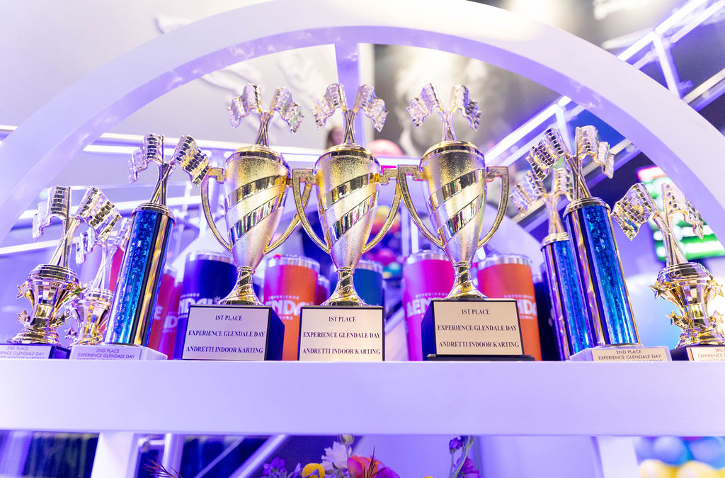 Experience Glendale Day race trophies on a branded display