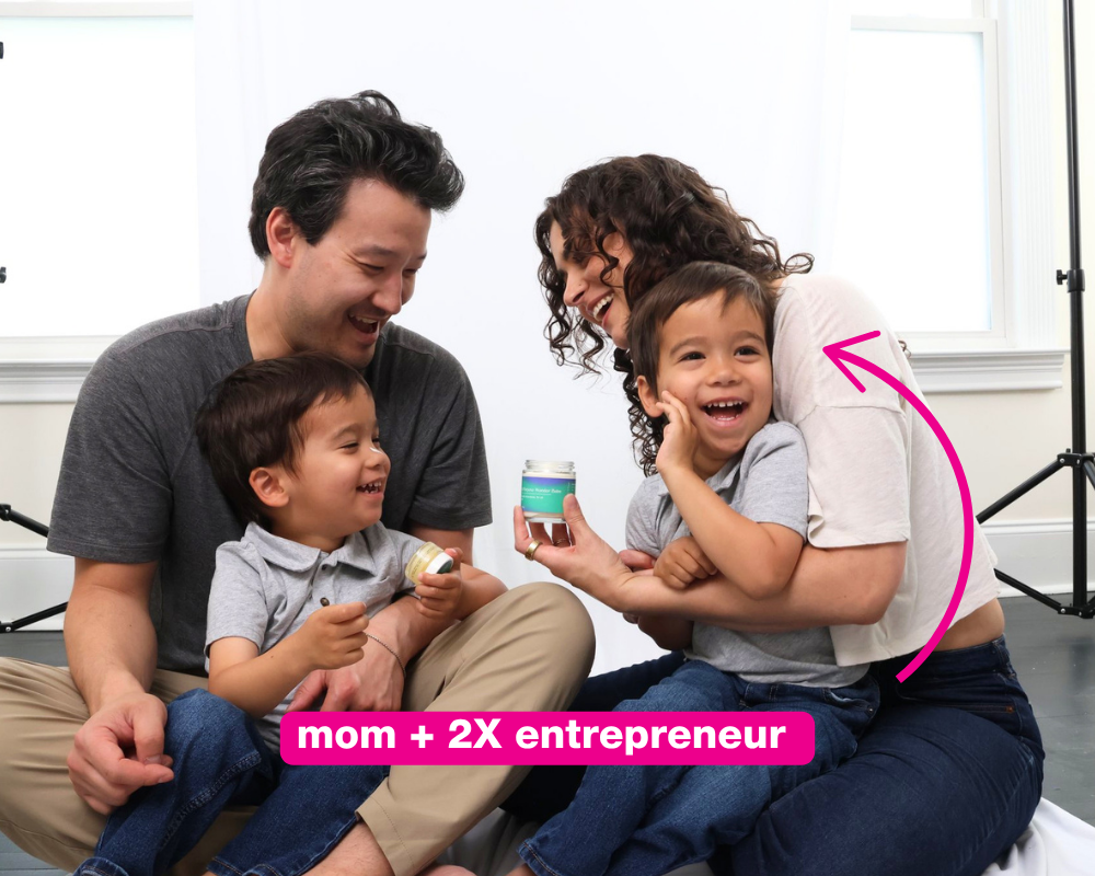 Gabi sitting on the floor with her husband and twins — 'in my mom AND entrepreneur era'
