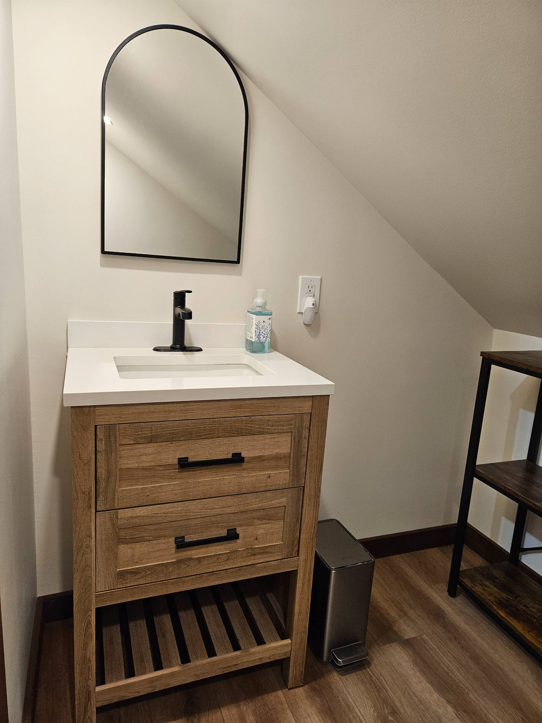 The upstairs bath handles the overflow — clean, simple, and right where the bedrooms need it.