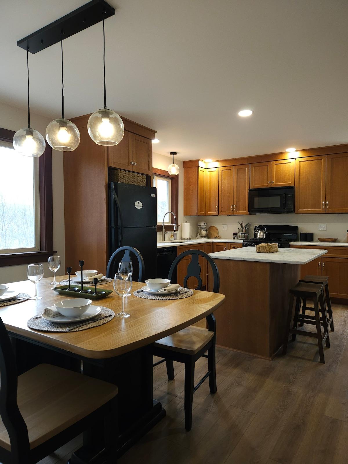 Everything you need is already here — full appliances, counter space, and a window that keeps the mountains in frame while you cook.