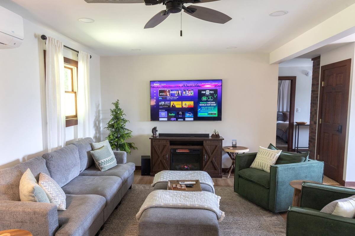 The living room is bright, open, and big enough that everyone can do their own thing and still be in the same room.