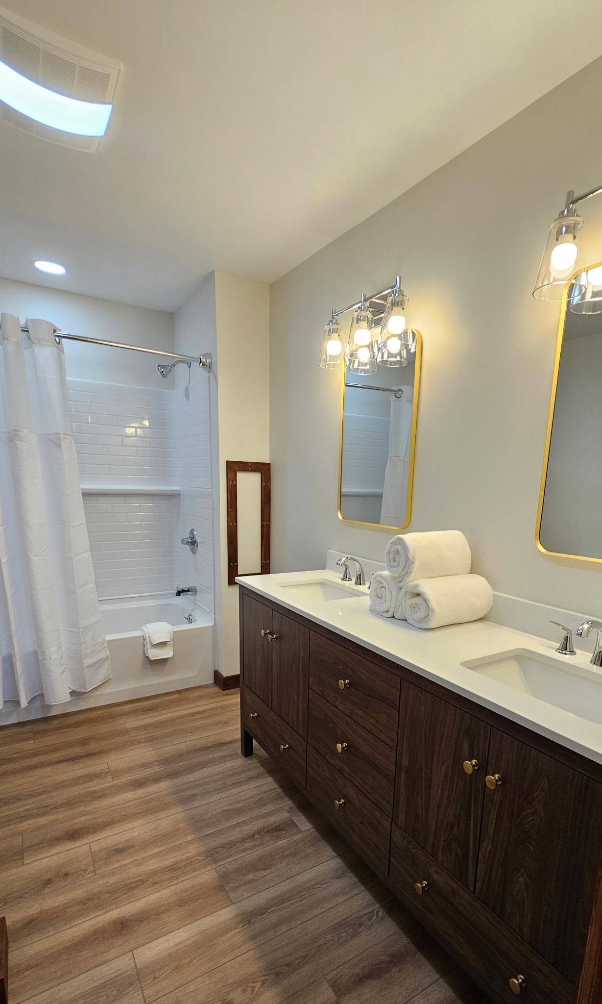 Your second full bath keeps the morning moving — fully stocked, clean, and even gives you a full size stacked washer and dryer.